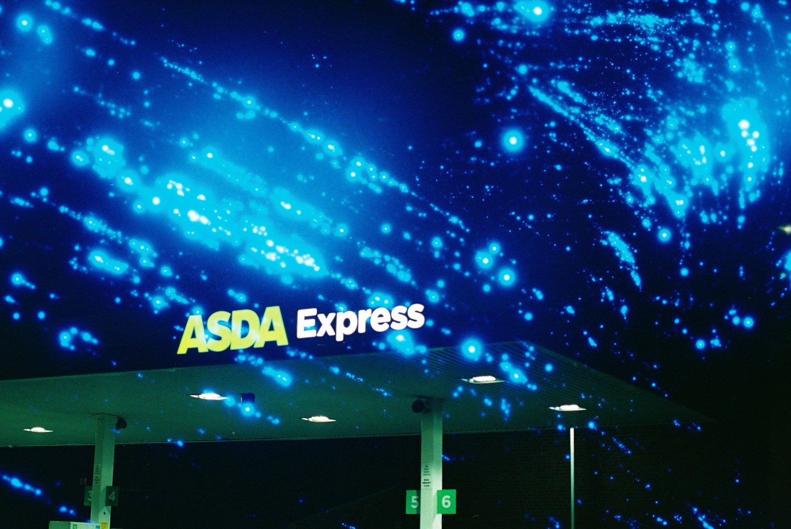 Asda express sign under a starry night sky